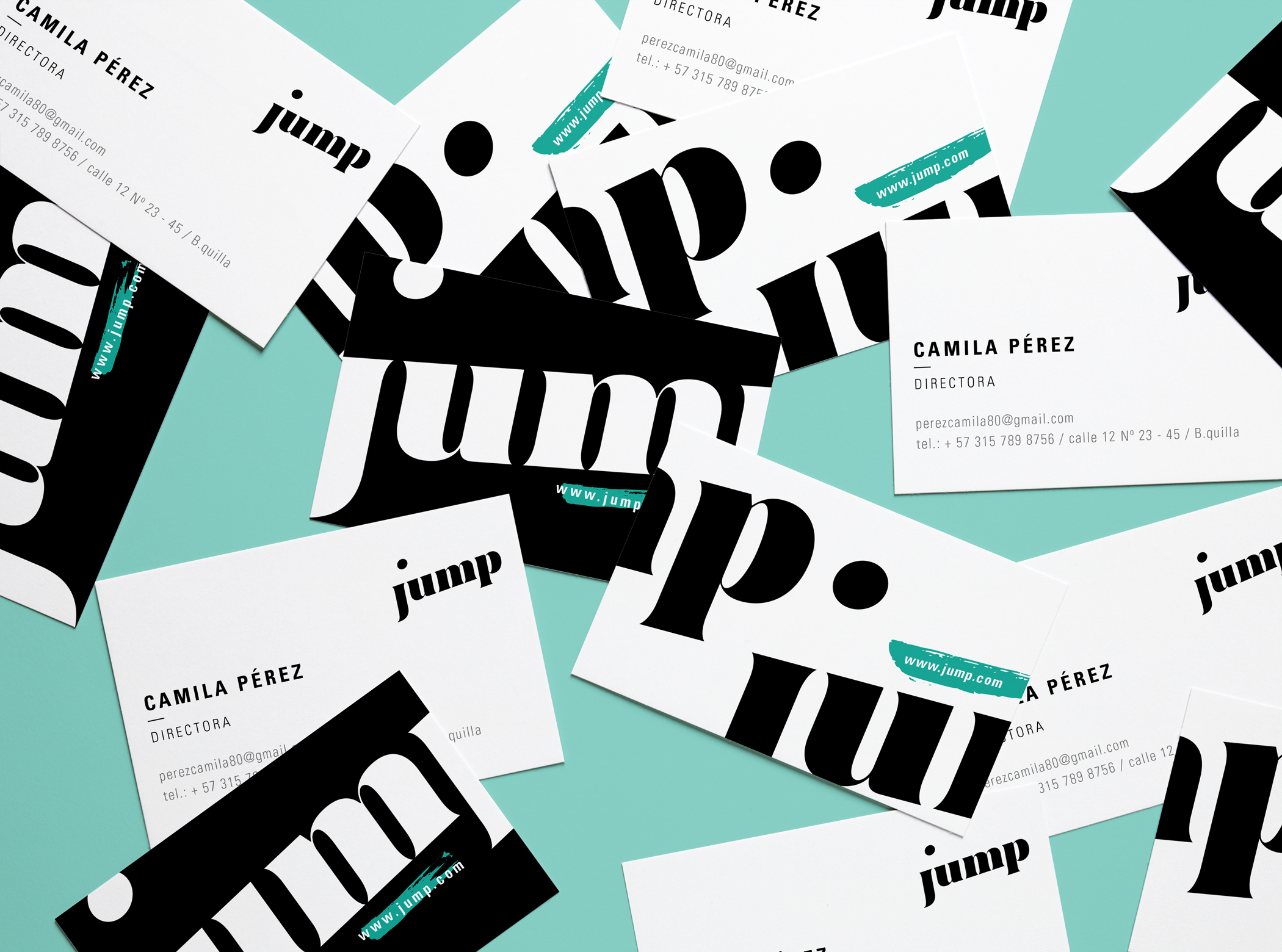 Jump business cards scattered — showing front and back system