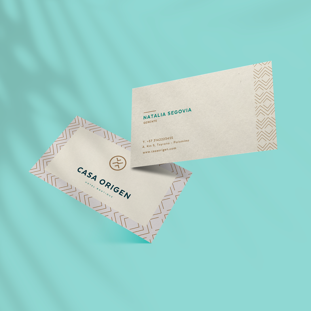 Casa Origen business cards — cream with gold geometric pattern, teal background
