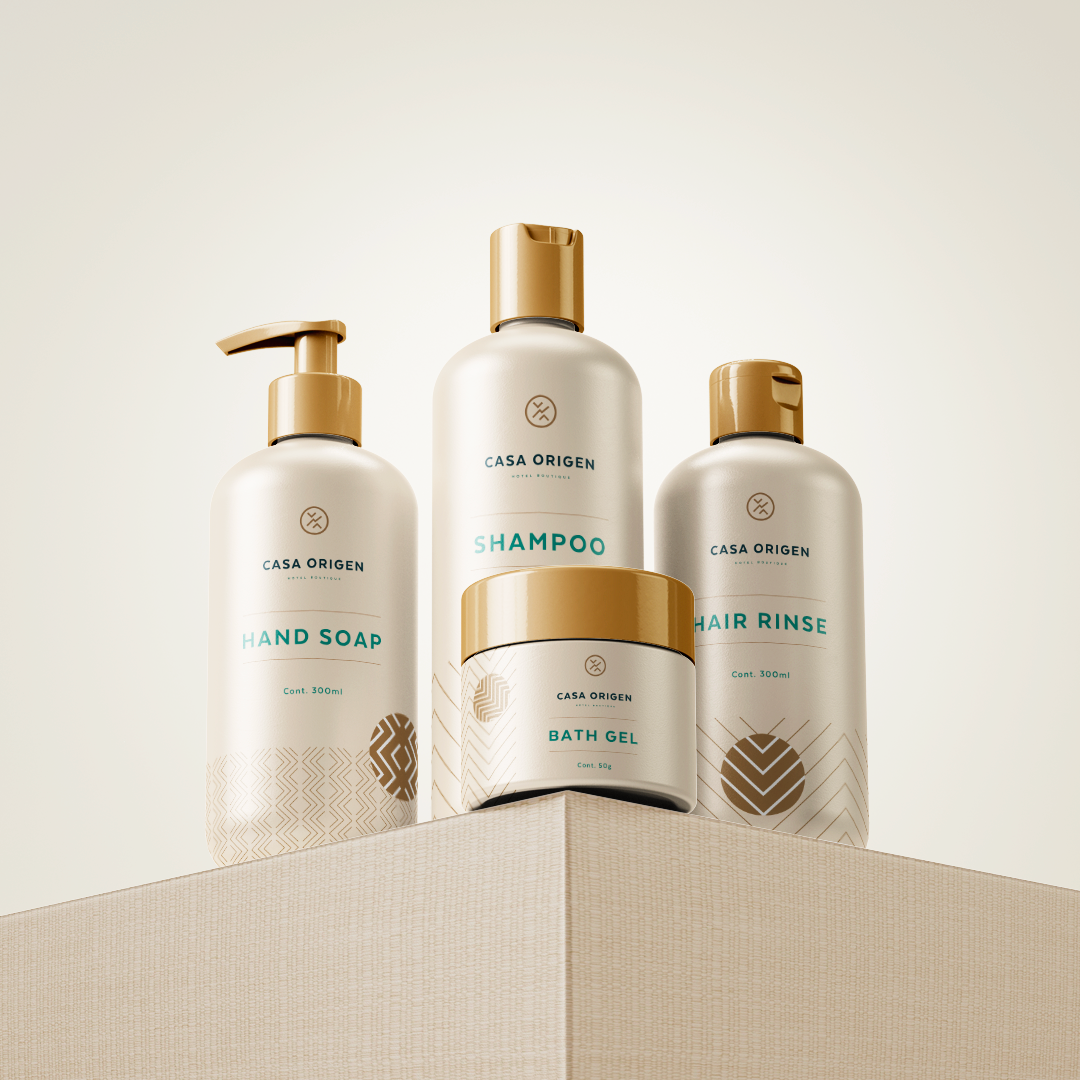 Casa Origen bathroom amenities — cream bottles with gold hardware and teal type